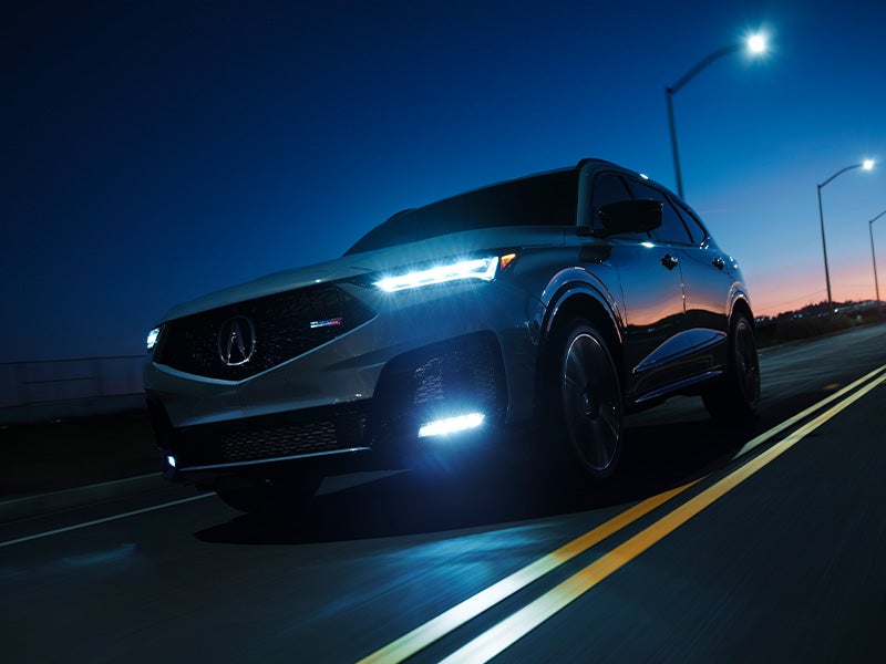 Acura SUV on the highway at night