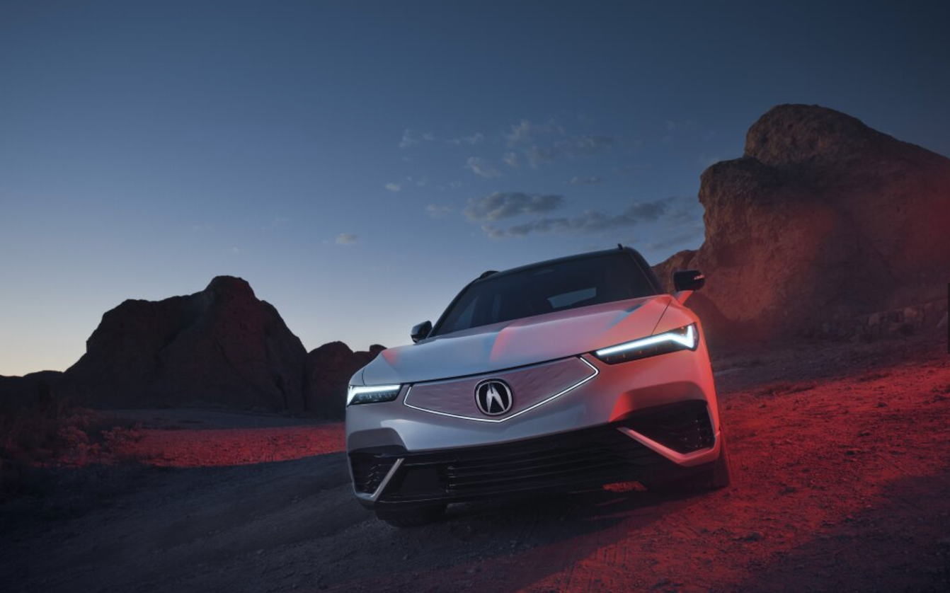 2024 Acura ZDX parked in the desert with ambient lighting 